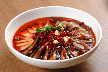  Close up of a popular Chinese Sichuan province cuisine Sliced Duck Blood in Chili Sauce oil with lunch meat, tripe and eel slices  (Chinese: Maoxuewang)