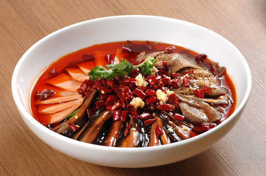  Close up of a popular Chinese Sichuan province cuisine Sliced Duck Blood in Chili Sauce oil with lunch meat, tripe and eel slices  (Chinese: Maoxuewang)