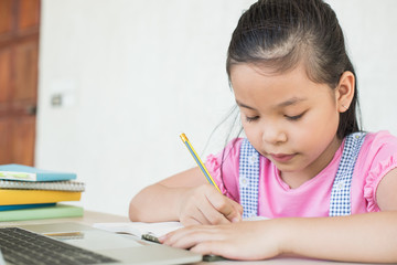 asian girl student online learning study online with video call teacher. social distance during quarantine, self-isolation, online education concept, homeschool, stay at home entertainment.