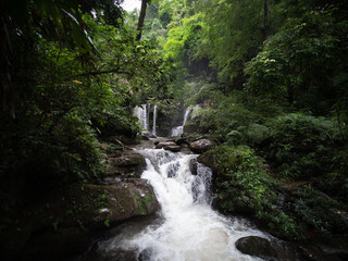 waterfall in Nan, Thailand. Waterfalls in green rain forest. Stream from waterfall.