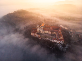 Drone aerial photo of Tyniec Abbey in mist near Krakow in Malopolska, Poland 