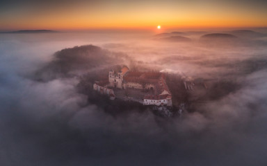 Fototapeta premium Drone aerial photo of Tyniec Abbey in mist near Krakow in Malopolska, Poland 