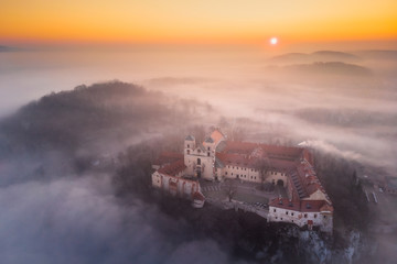 Drone aerial photo of Tyniec Abbey in mist near Krakow in Malopolska, Poland 