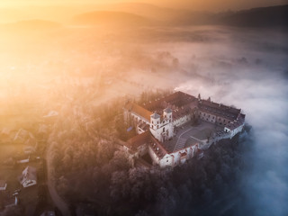 Drone aerial photo of Tyniec Abbey in mist near Krakow in Malopolska, Poland 