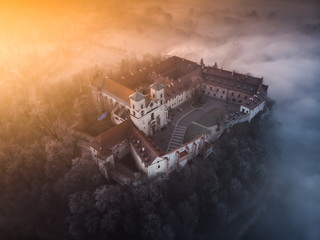 Drone aerial photo of Tyniec Abbey in mist near Krakow in Malopolska, Poland 