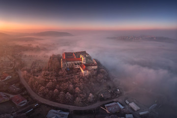 Drone aerial photo of Tyniec Abbey in mist near Krakow in Malopolska, Poland 