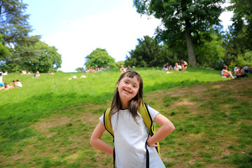 Portrait of little girl smiling in the park - 372892396