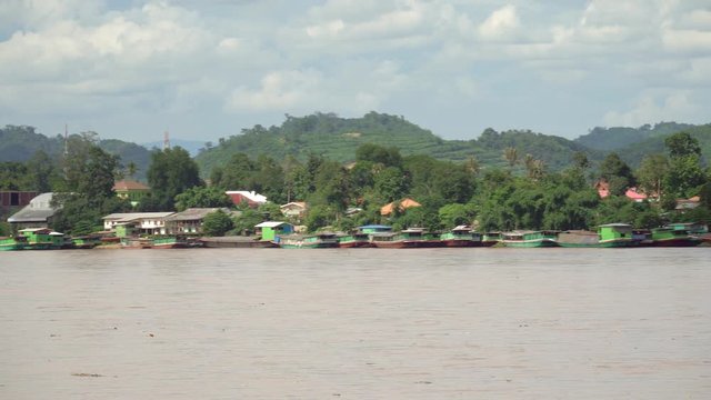 Laos cargo boats are moored on the Mekong River opposite side  Chiang Sean, Thailand