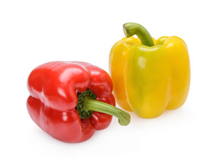 Fresh sweet peppers with separate leaves on a white background