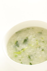Chinese food, spinach and rice porridge in white bowl