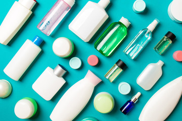 Group of plastic bodycare bottle Flat lay composition with cosmetic products on colored background empty space for you design. Set of White Cosmetic containers, top view with copy space