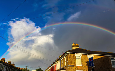 Double rainbow, blue sky and clouds. - Powered by Adobe