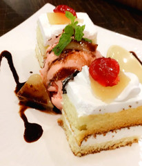 White ice cream pastry with berry and mint topping 