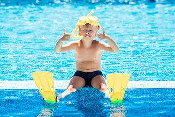 Cute child in the swimming pool