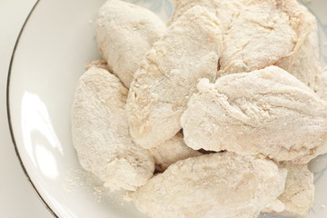 Homemade Korean food, prepared flour and marinated chicken wing for fried chicken cooking