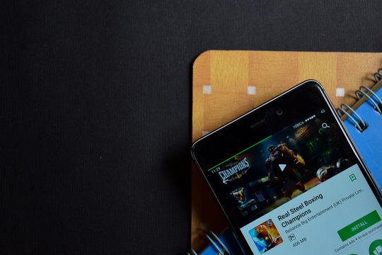 Real Steel Boxing Champions dev app on Smartphone screen. Real Steel is a freeware web browser developed by Reliance Entertainment (UK)

