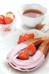 strawberry chocolate churros and fruit on dish for gourmet dessert