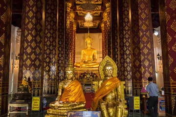 Fototapeta premium Ayutthaya, Thailand - June, 22, 2020 : Golden buddha image in ancient temple in Ayutthaya , Thailand