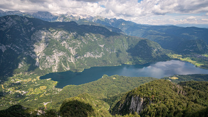 birds view of lake Bohinj in Slovenia. view from the top of Vogel mountain with the julian alps in...