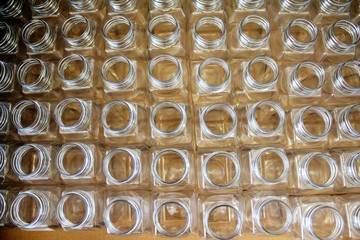Clean plastic bottles stacked in a factory.