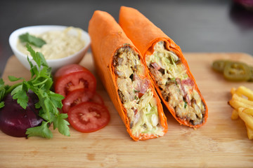 kebab meat with vegetables on a wheat tortilla