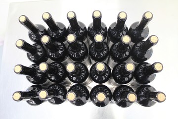 Glass bottles stacked in a wine factory.