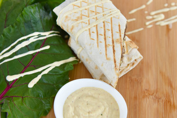 kebab meat with vegetables on a wheat tortilla