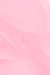 Fototapeta na wymiar Soft light pink flowing fabric, beautiful pink color background