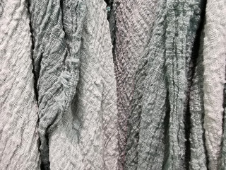 grey fabric texture. Crumpled cloth textile background. Draped raw organic cloth grey tonos pattern
