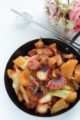 Korean food, octopus and potato stir fried with cabbage