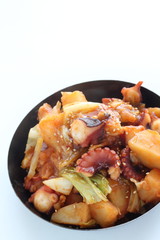 Korean food, octopus and potato stir fried with cabbage