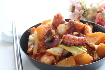 Korean food, octopus and potato stir fried with cabbage