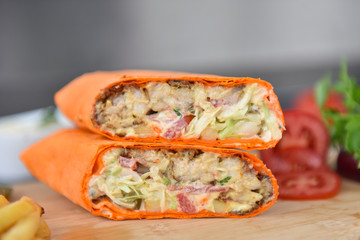 kebab meat with vegetables on a wheat tortilla