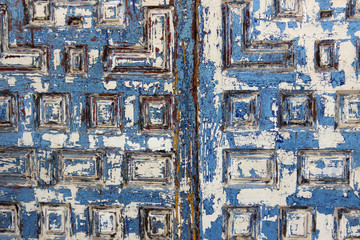 Vintage and weathered blue painted wooden door