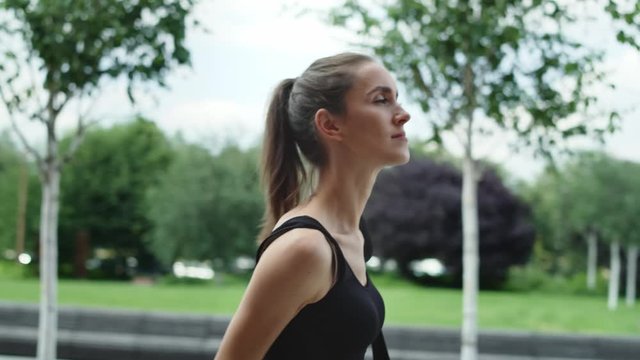 Video of woman walking in training outfit. Shot with RED helium camera in 8K. 