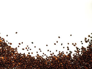 Fototapeta premium coffee beans scattered on a white background. aromatic arabica on a background with copy space. mockup