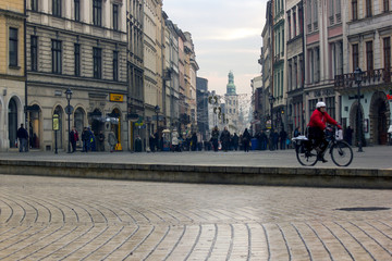 Obraz premium Krakow, Poland - December: Decorated street during Christmas decoration at city center main square with tourists and people doing leisure