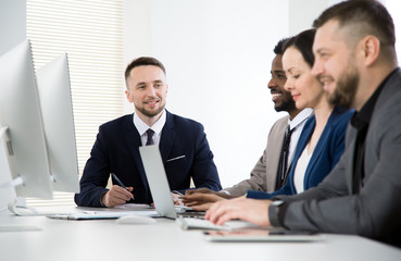 Multy-ethnic group of business people working at office