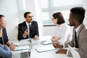 Multy-ethnic group of business people working at office