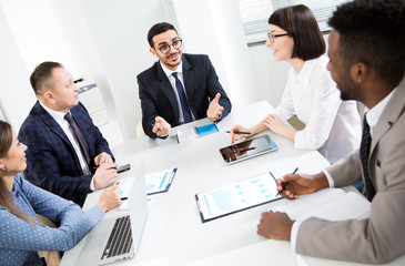 Fototapeta premium Multy-ethnic group of business people working at office