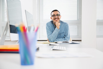 Portrait of a happy student works in a computer class