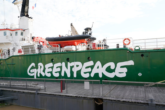 Greenpeace logo and text sign on green ship Arctic Sunrise