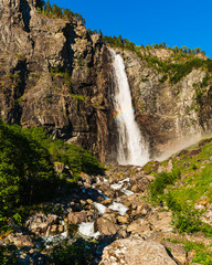 Obraz premium Beautiful Norwegian waterfall with blue sky