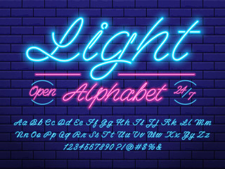 Fototapeta na wymiar Glowing neon light alphabet design with uppercase, lowercase, numbers and symbols