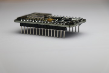 Side view of development board which is used in making IOT projects and other mini electronic projects in white background