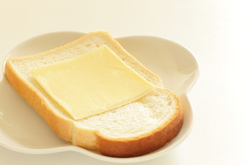 Sliced cheese on bread for breakfast