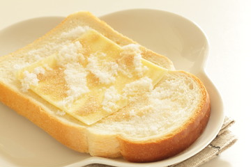 sliced cheese and sugar on toast for asian broakfast