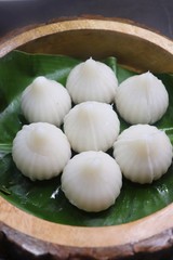 Steamed or ukdiche Modak - a traditional sweet dish made out of coconut, jaggery and dry fruits stuffed inside rice dough on Ganpati festival in India. with copy space