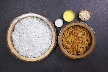 Ganesh Chaturthi special dish Modak. Indigents for Modak preparation. Grated coconut, Jaggery, Ghee or clarified butter, cardamom powder, and crushed almonds. Copy space.