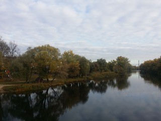 Beautiful autumn landscape forest and river with water reflection day light  Sumy region Ukraine